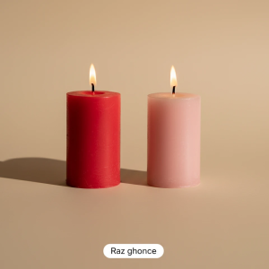 two burning cylindrical candles in red and pale pink colors on beige background, RAZ GHONCHE