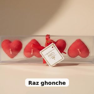 set of four red heart-shaped textured candles with pearl pattern, packed in clear plastic box tied with red ribbon and CBM label, RAZ GHONCHE