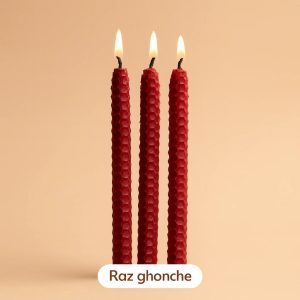 three red honeycomb taper candles burning with soft light on beige background, RAZ GHONCHE